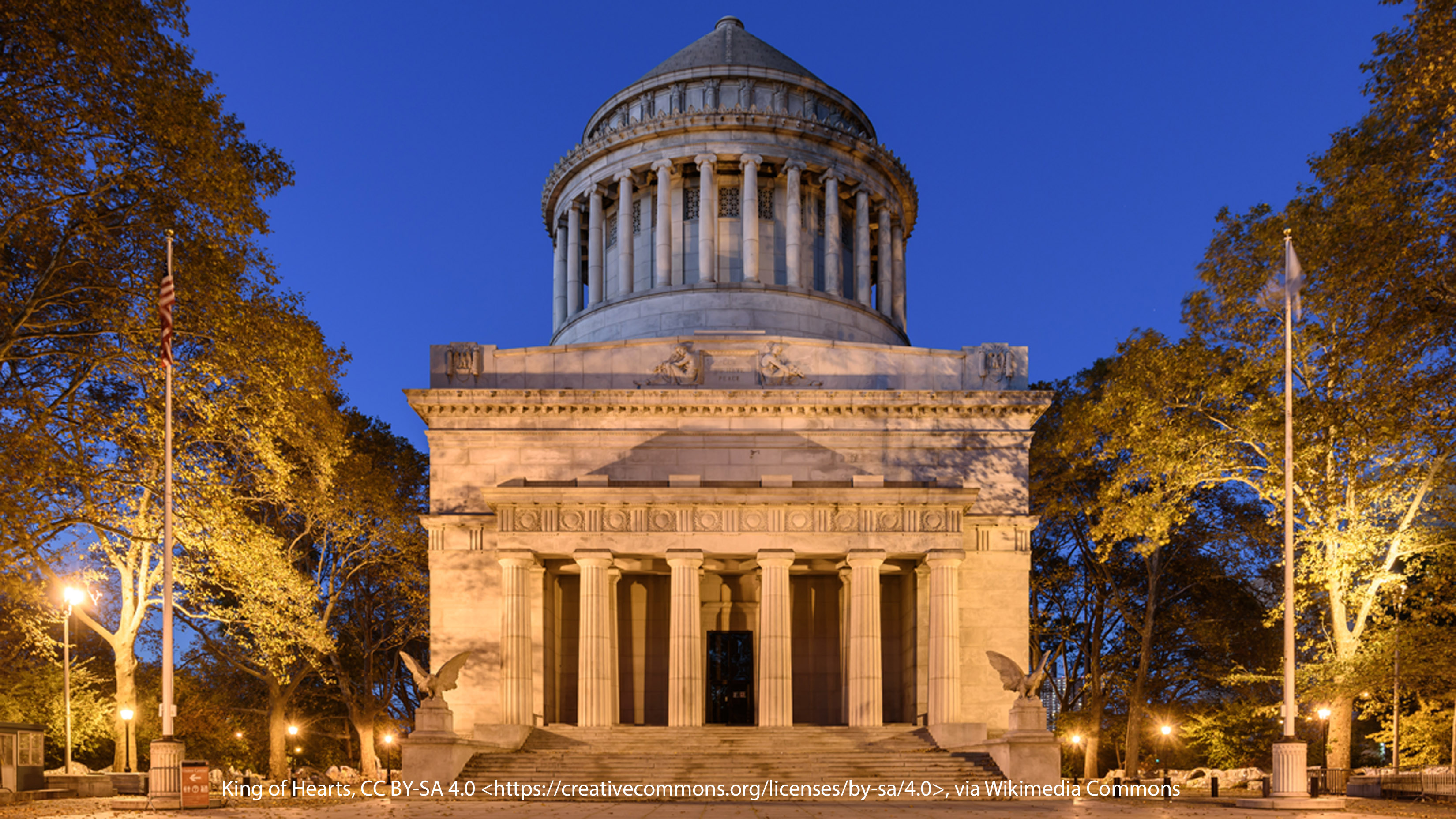 Photograph of Grant's Tomb exterior at night, showing the monument illuminated against the dark sky